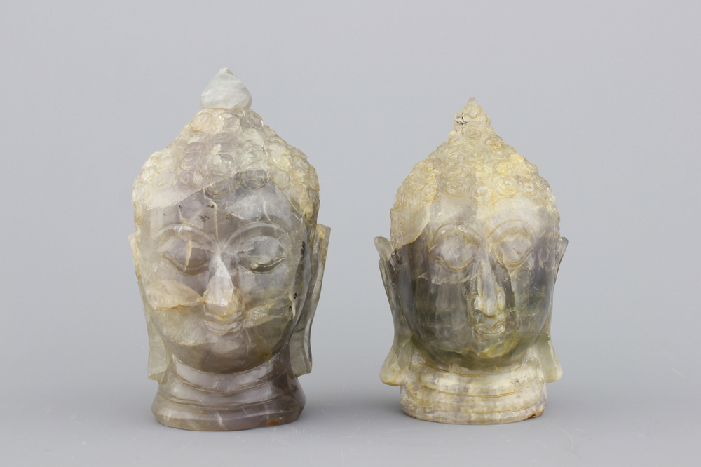 A pair of Chinese carved quartz buddha heads, 20th C.