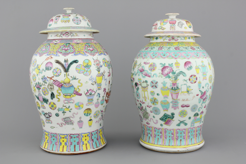 Two Chinese porcelain famille rose jars and covers with scholar's objects, 19th C.
