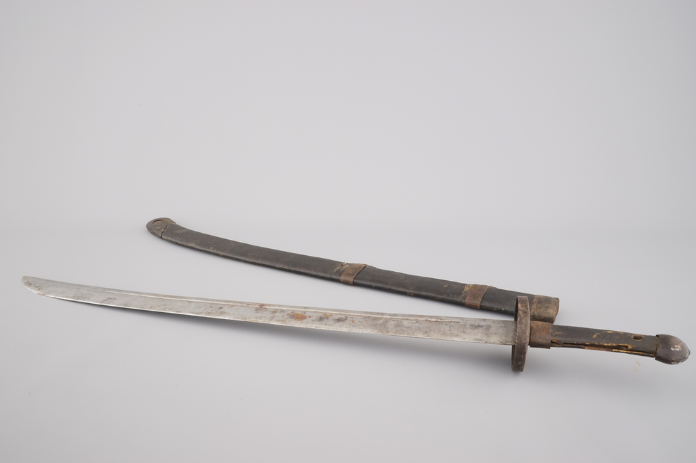 A Japanese sword in leather case, 19/20th C.