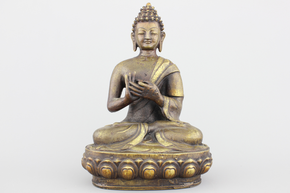 A Sino-Tibetan partly gilt bronze buddha, 19/20th C.