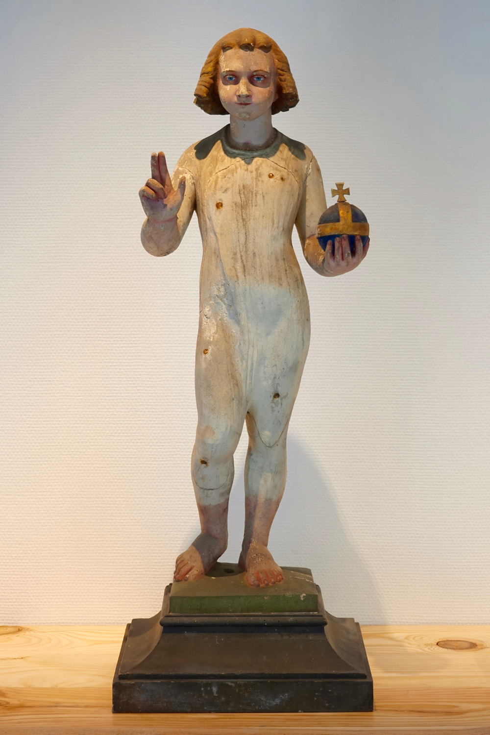 A tall sculpted wood figure of Christ with the globe, 19/20th C., Bruges