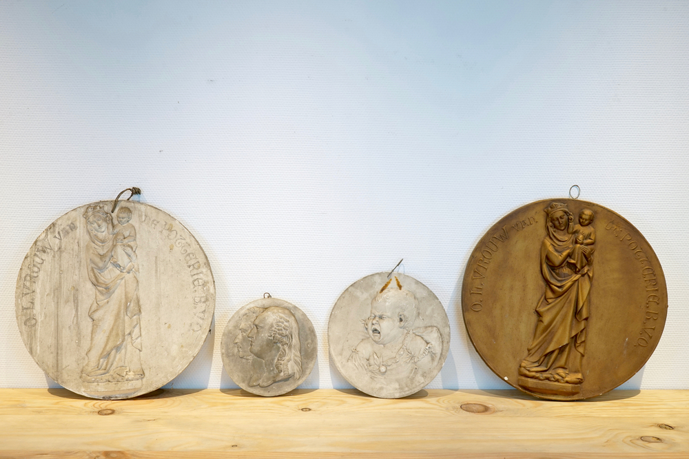 A set of four plaster casts of medallions, two showing Our-lady-of the Potterie, 19/20th C., Bruges