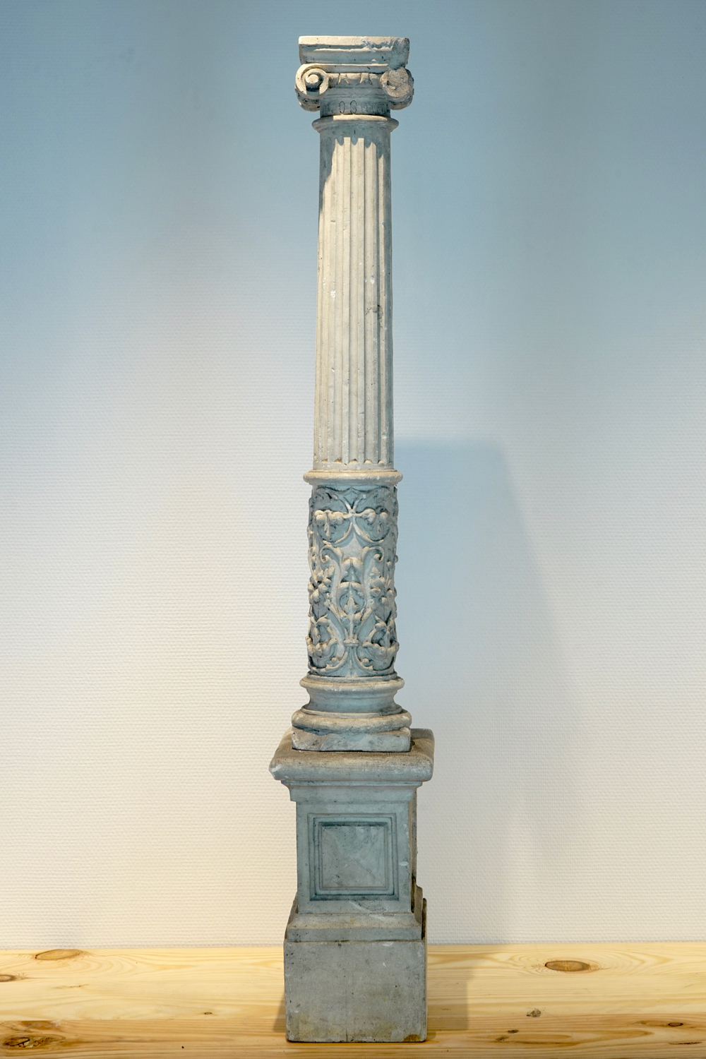 A plaster cast of an Ionic column on stand, 19/20th C., Bruges