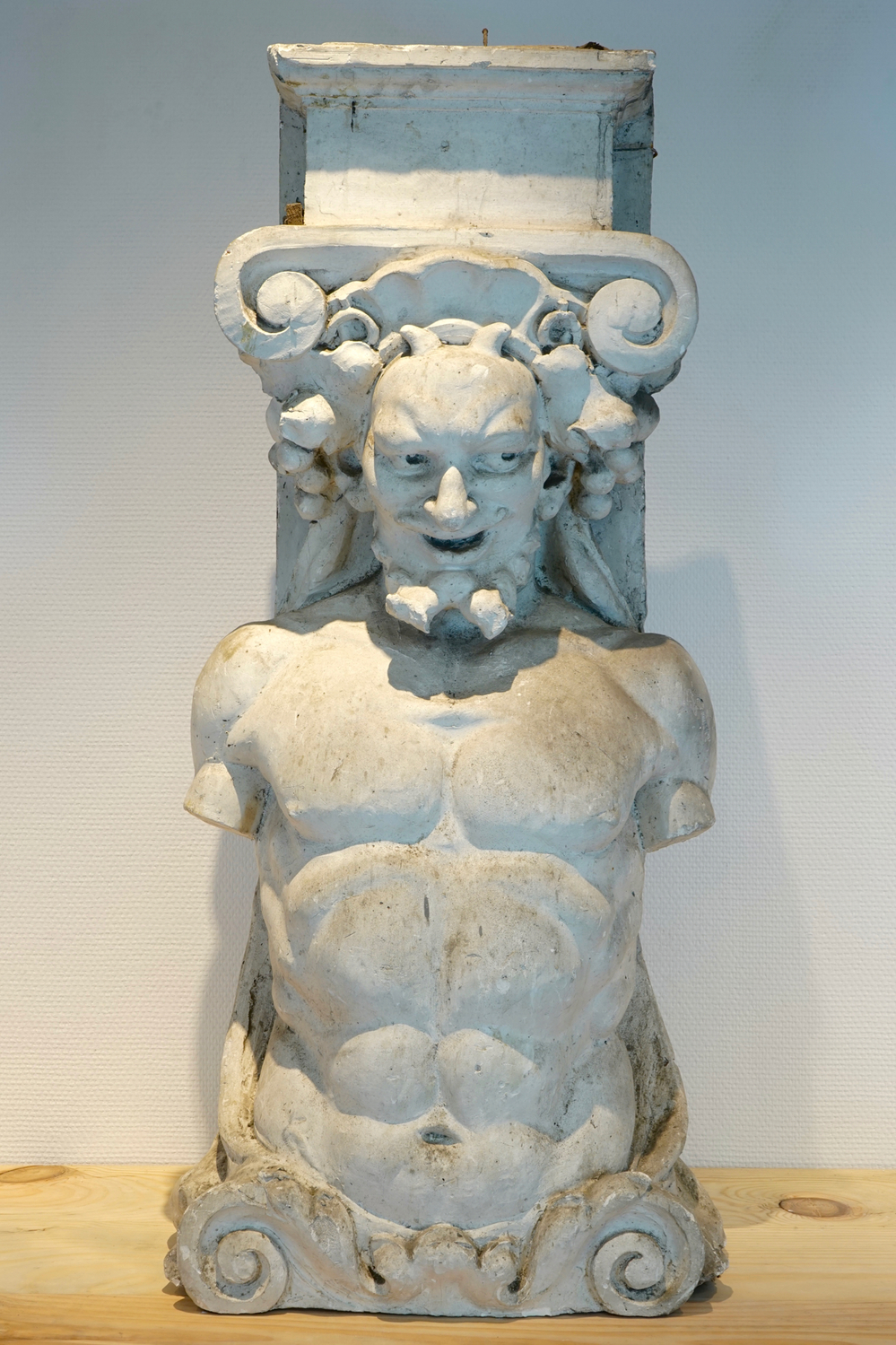 A plaster cast of an atlas or telamon, 19/20th C., Bruges
