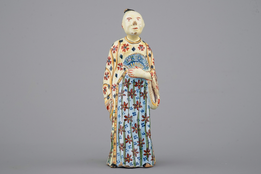 A yellow ground polychrome Dutch Delft figure of a Chinaman, 18th C.