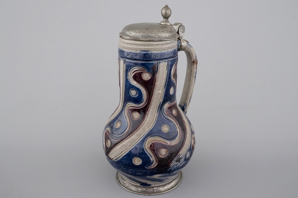 A Westerwald pewter-mounted jug in manganese and blue, 17th C.