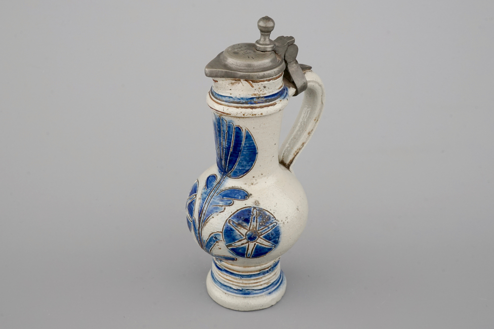 A Westerwald stoneware pewter-mounted jug with floral decoration, 17th C.