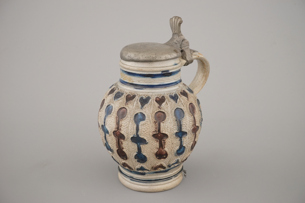 A manganese and blue Westerwald pewter-mounted globular jug, 17th C.