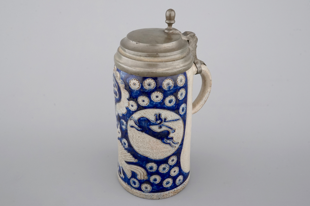 A tall Westerwald incised and pewter-mounted beer stein with deers and birds, 17th C.