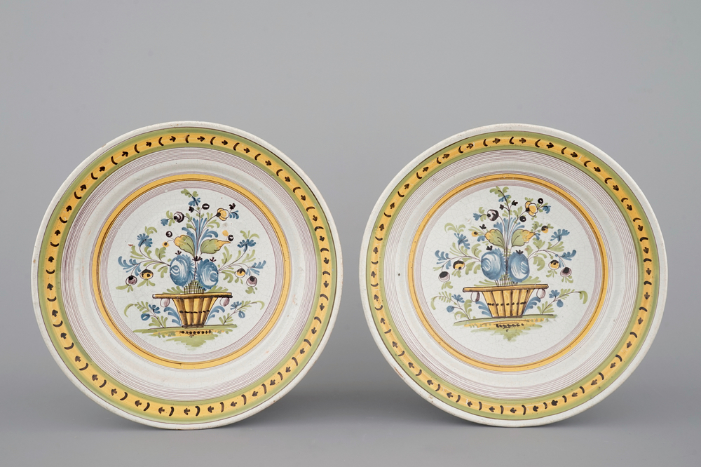 A pair of Brussels faience plates with flower vases, 18th C.