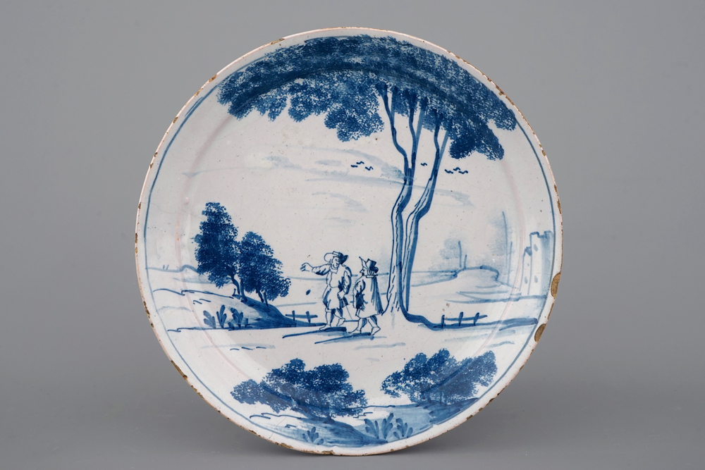 A fine English Delftware blue and white landscape plate, 18th C.