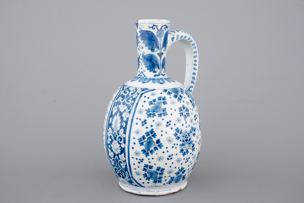 A large Dutch Delft blue and white jug, 18th C.