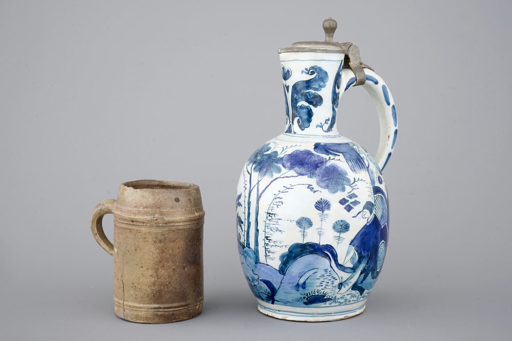 A Dutch Delft blue and white chinoiserie jug, 17th C. and a stoneware mug, 15th C.