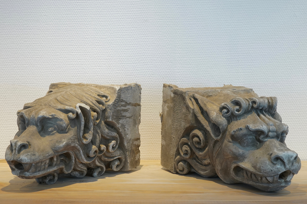 A pair of plaster casts of gargoyle heads, 19/20th C., Bruges