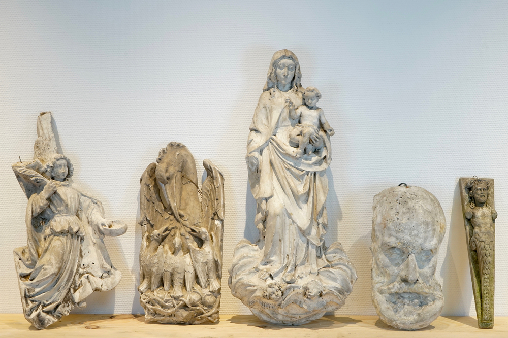 Five various plaster casts including a pelican and a bearded man's face, 19/20th C., Bruges