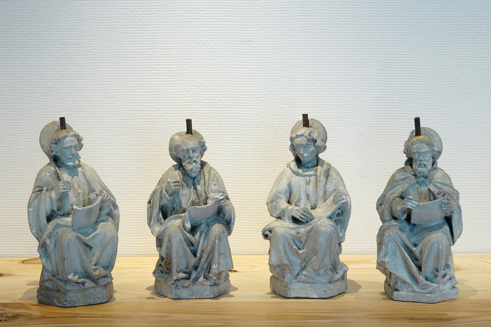 A set of four 27 cm plaster casts of seated saints reading a book, 19/20th C., Bruges