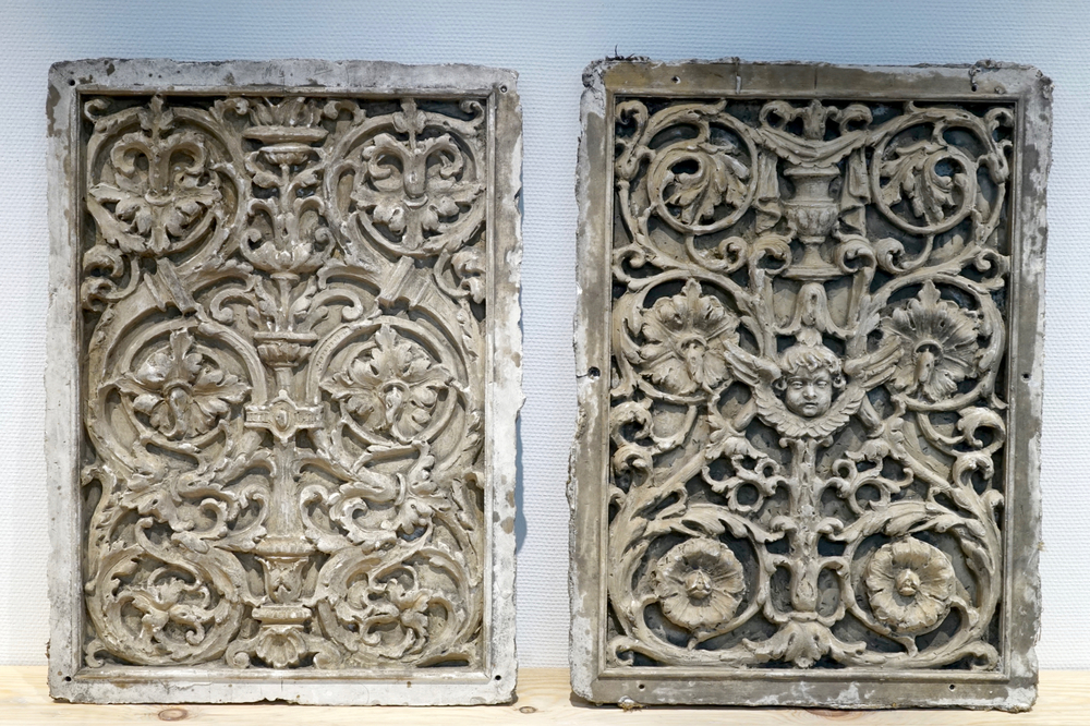 A set of two large ornamental plaster cast plaques, 19/20th C., Bruges