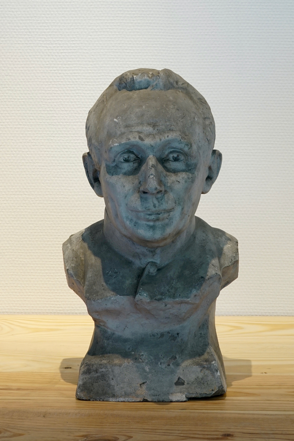 A plaster cast of a young man's bust, 19/20th C., Bruges