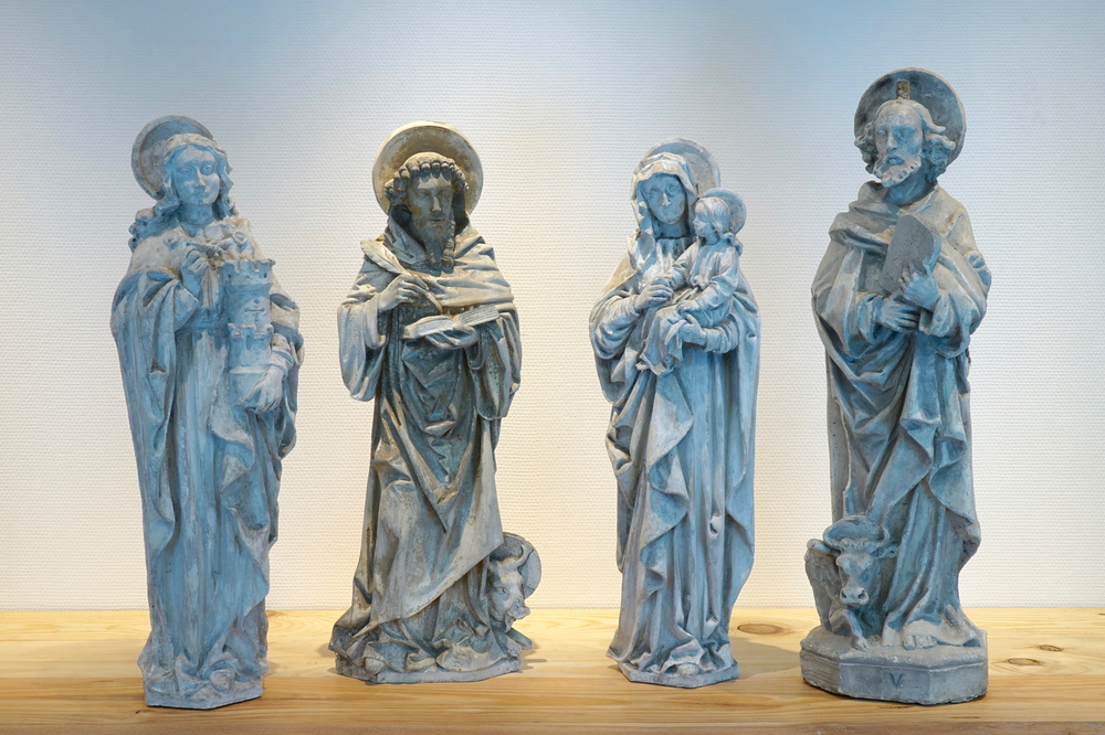 A set of four 70 cm plaster casts of religious figures, a.o. Saint Barbara and Saint Thomas, 19/20th C., Bruges