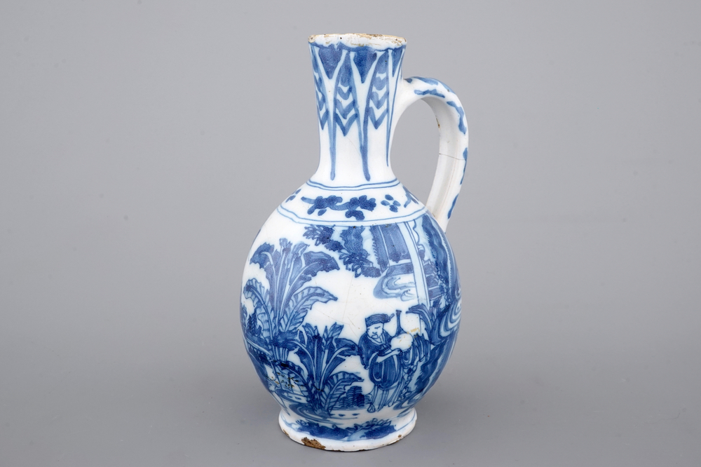 A Dutch Delft blue and white chinoiserie jug, 17th C.