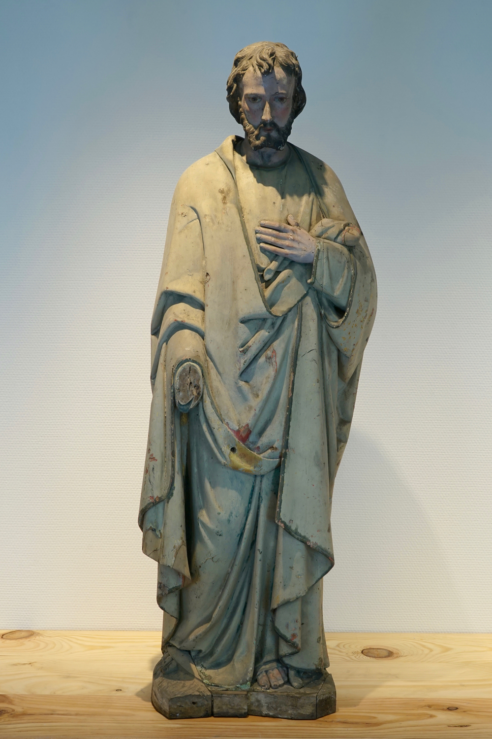 A massive sculpted wood polychrome figure of a saint, 19/20th C., Bruges