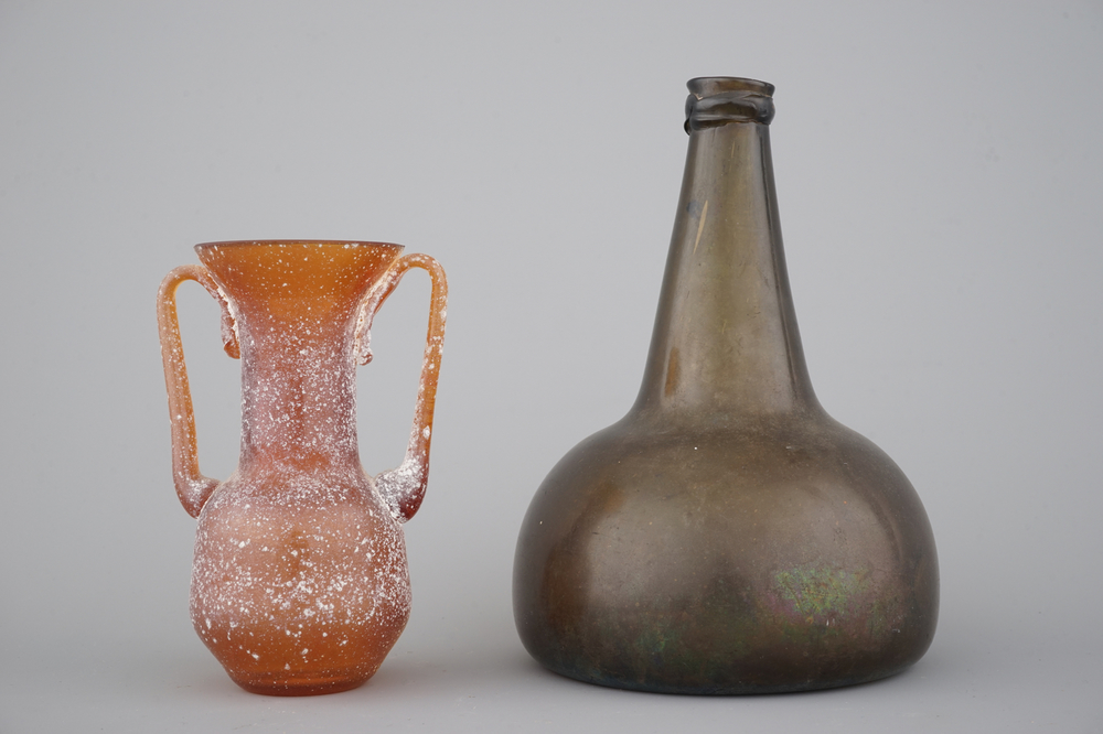 A green glass wine bottle, 18th C. and an orange glass amphora after the Antique
