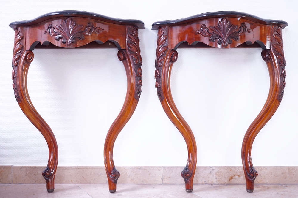 A fine pair of carved wood wall console tables, 19th C.