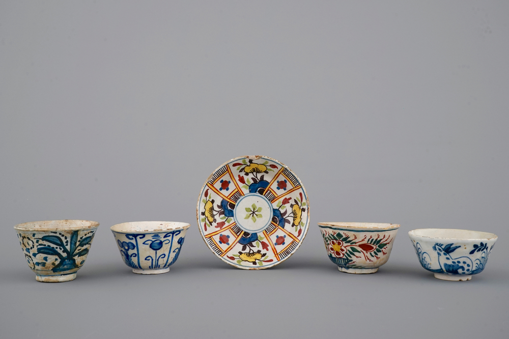 A set of 4 rare Dutch Delft tea cups and a saucer, 17/18th C.