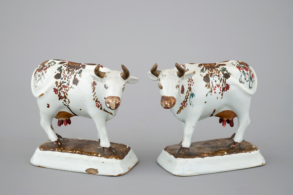 A pair of white Delft cold-painted cows, Dutch, 18th C.