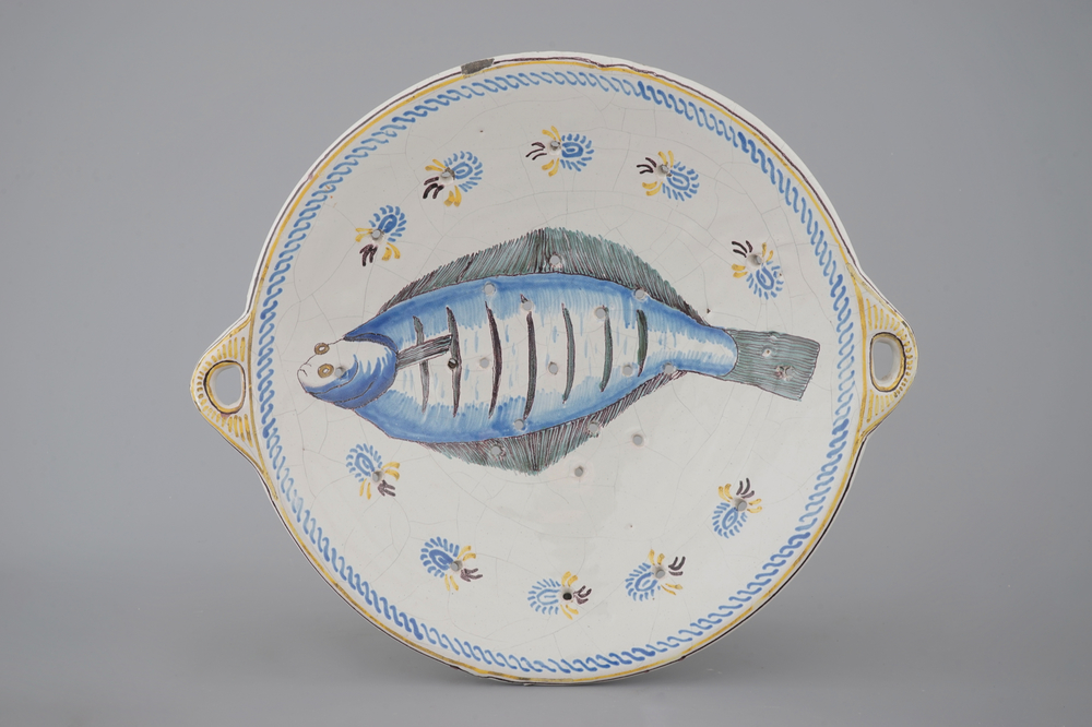A rare polychrome Frisian Dutch Delft fish strainer, probably Makkum, 19th C.