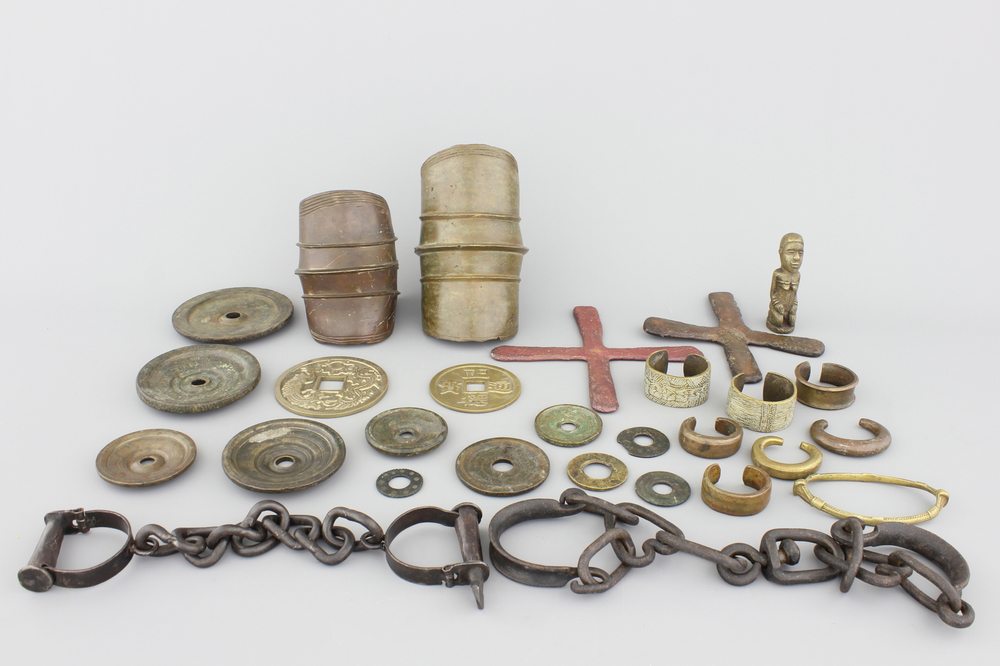 A selection of African bronze bracelets, coins, chains and other items, 19/20th C.