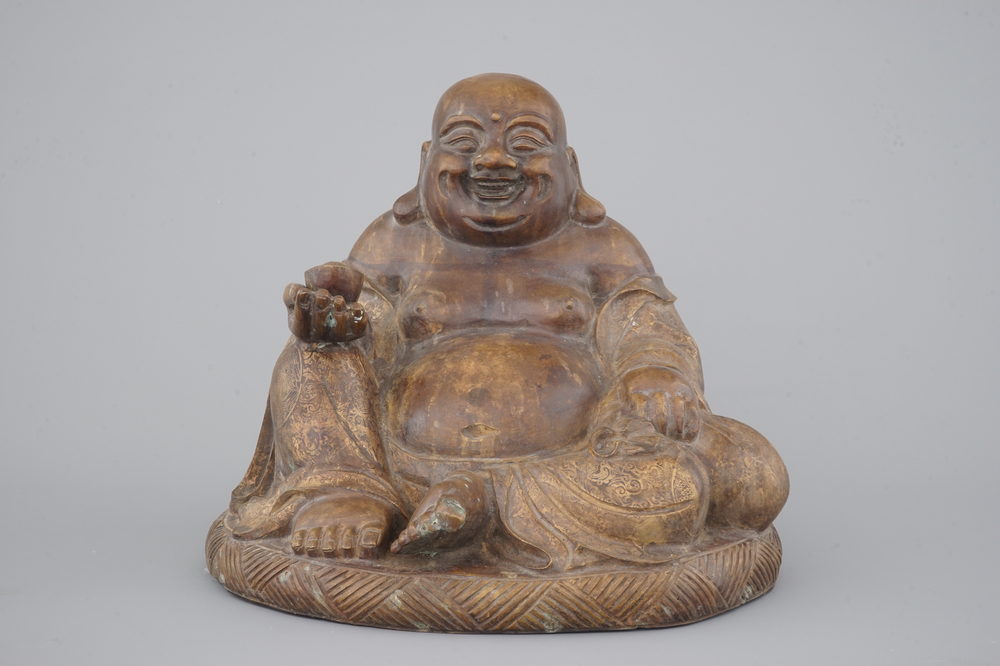 A partial gilt seated bronze buddha, Yongzheng mark, 19th C. or earlier