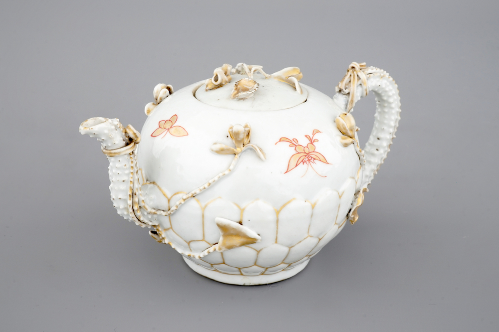 A Chinese relief-decorated gilt tea pot, Yongzheng, 18th C.