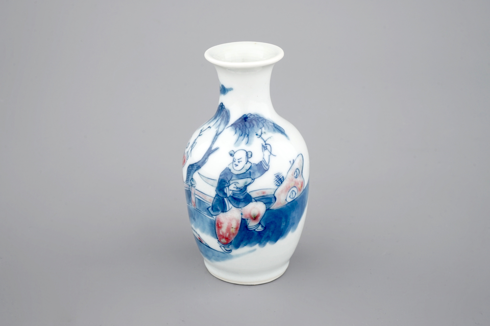 A Chinese porcelain blue and underglaze red vase with a playing boy, 19/20th C