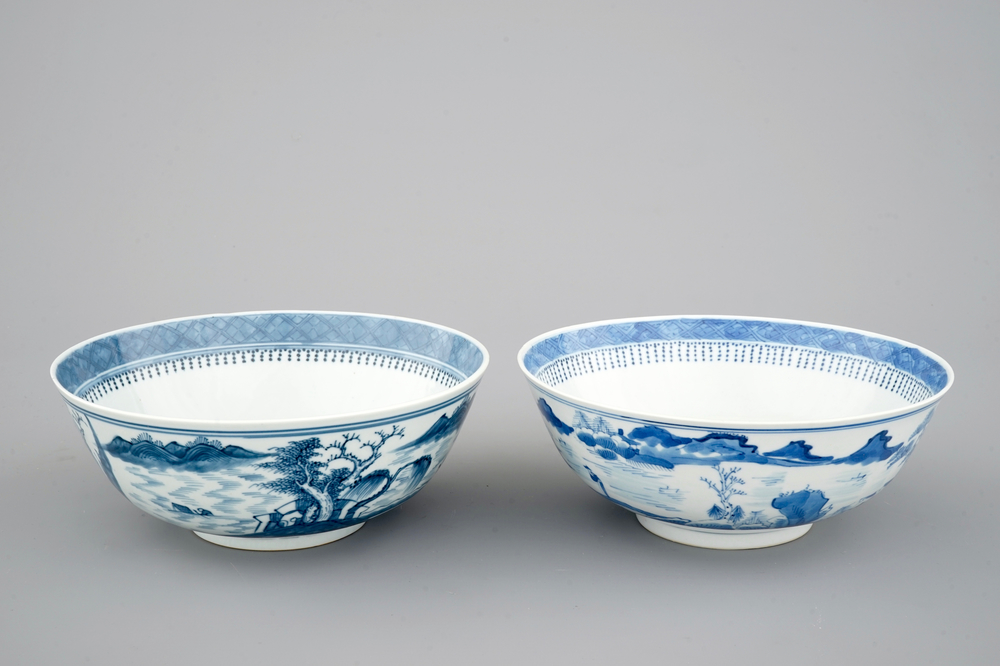 A pair of Chinese blue and white bowls decorated with landscapes, 19th C