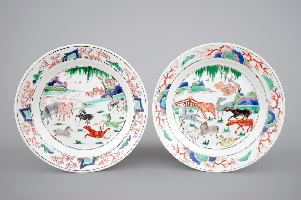 A pair of Chinese famille verte porcelain plates with &quot;The 8 horses of Mu Wang&quot;, Kangxi, ca. 1700