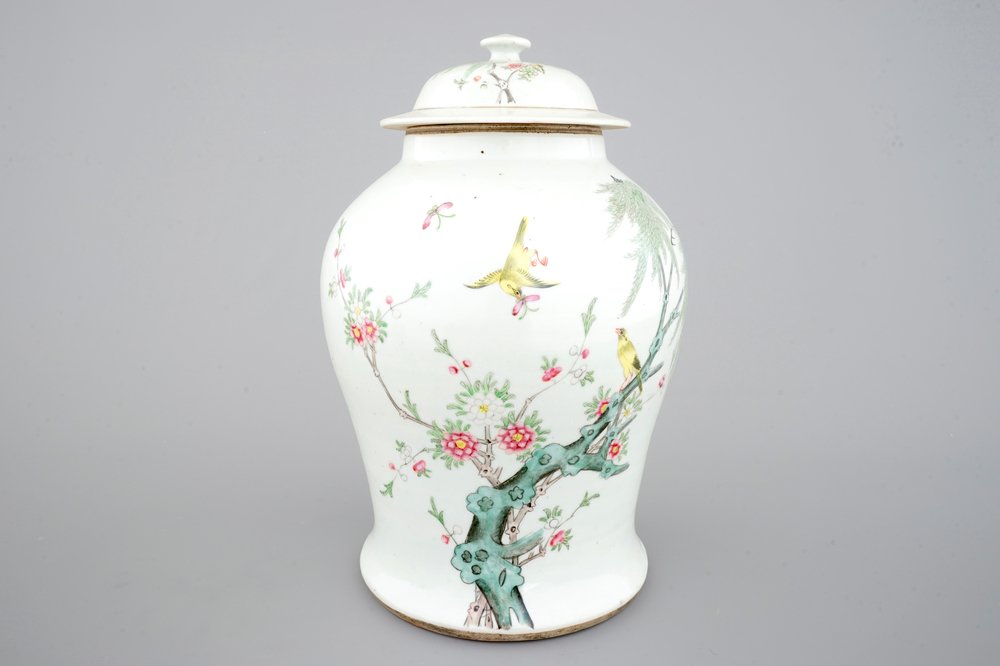 A Chinese famille rose vase and cover with birds on a branch, 19th C.