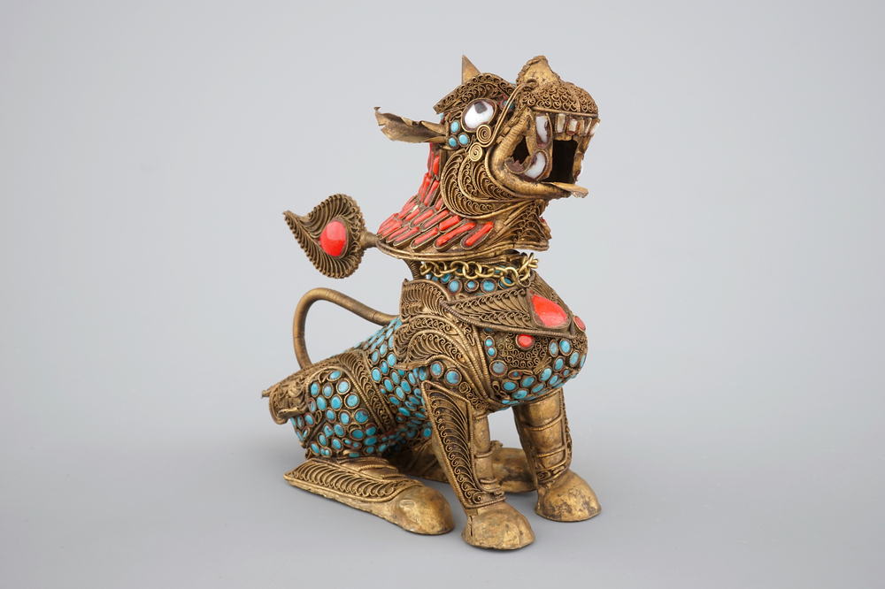 A Chinese or Sino-Tibetan filigree brass, turquoise and coral incense burner in the shape of a foo dog, 20th C.