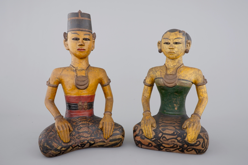 Two tall Indonesian cold-painted pottery figures of servants, 19th C.