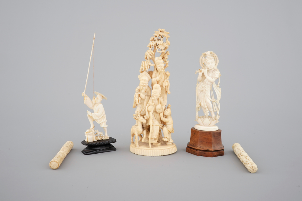 A carved Chinese ivory group of 3 Immortals, a fisherman and two needle cases, with an Indian carved ivory goddess, 19th C.