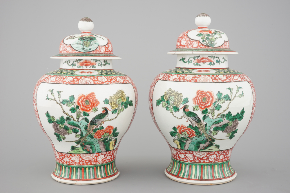 A pair of Chinese famille verte porcelain baluster vases and covers, 19th C.