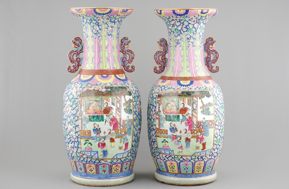 A massive pair of Chinese relief-decorated famille rose porcelain vases, 19th C.
