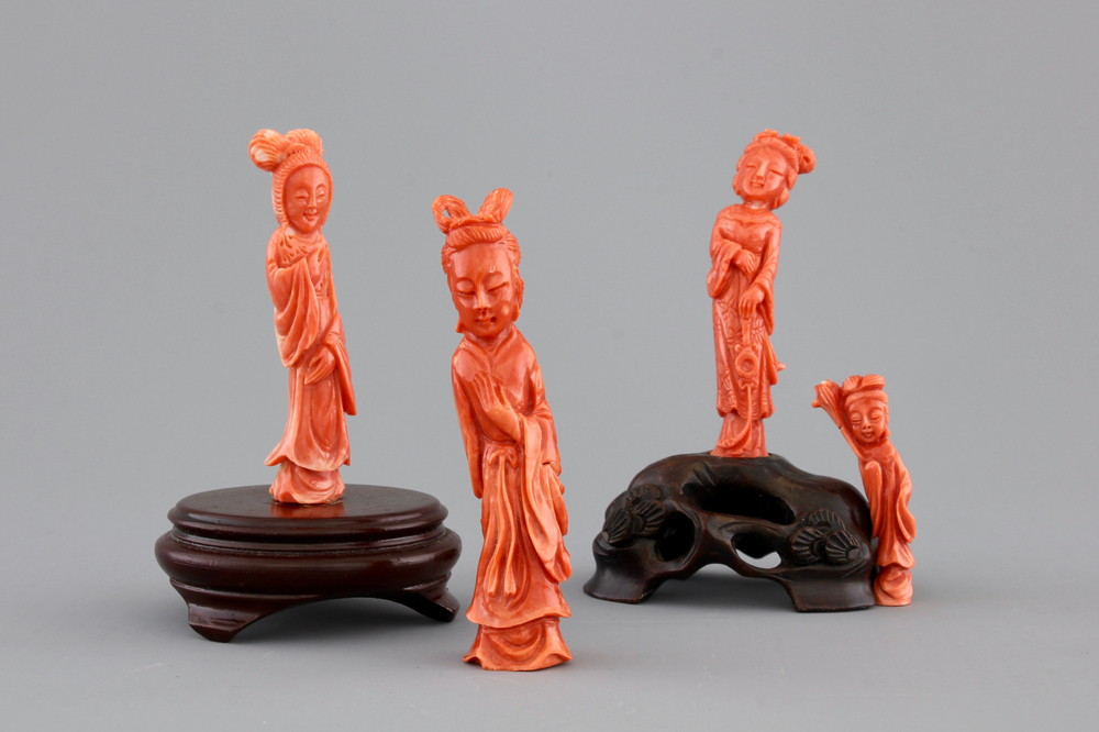 Four Chinese carved red coral figures, 19/20th C.
