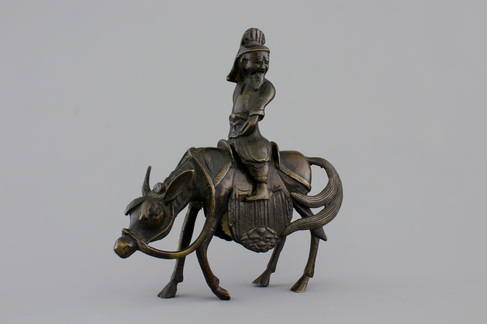 A Chinese bronze figure of a sage on a donkey, 18/19th C
