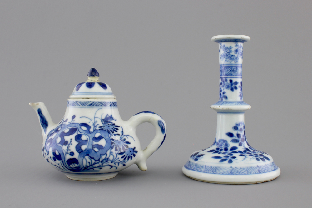 A Chinese blue and white porcelain candlestick and a miniature teapot, 18th C.