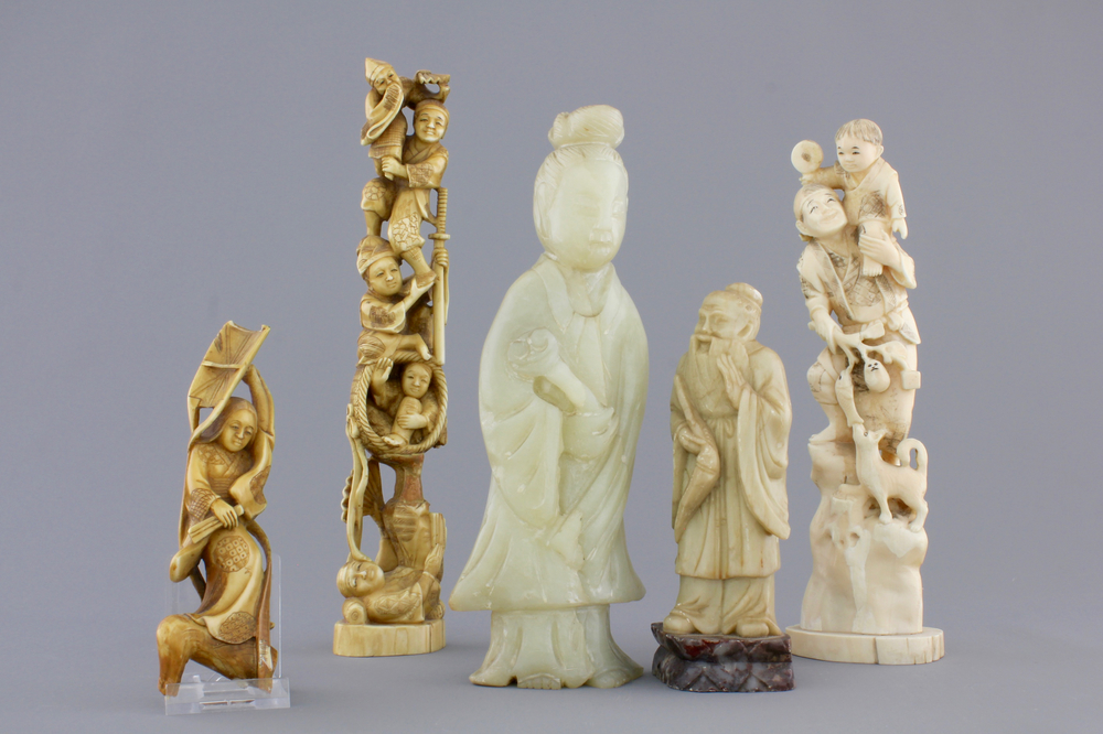 A group of various Chinese and Japanese carvings in soapstone, ivory and jadeite, 19th C.