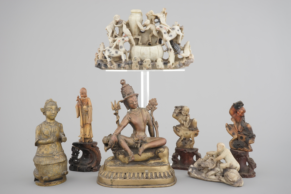 Two Chinese or Tibetan bronze figures, one of Tara seated on a tiger and a set of soapstone carvings, 18/19th C.