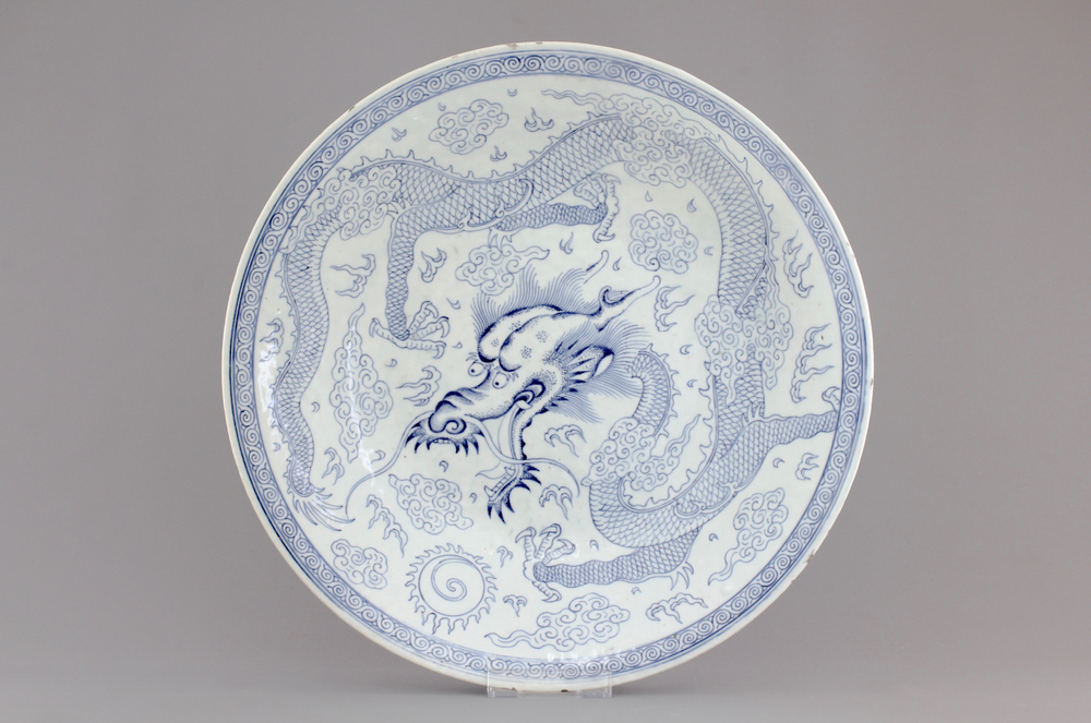An attractive large blue and white Chinese porcelain dish with a dragon, 19th C.