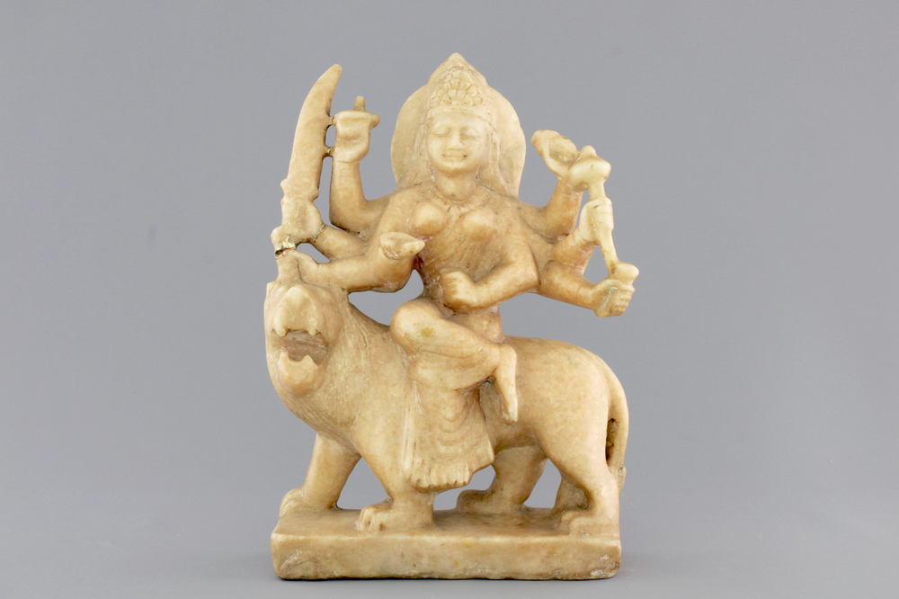 An Indian carved alabaster group of the goddess Durga on her lion &quot;Vahana&quot;, 19th C.