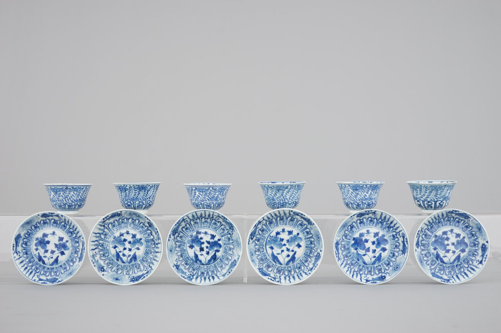 A set of six Chinese blue and white cups and saucers with fish, 19th C.